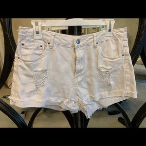 White ripped shorts